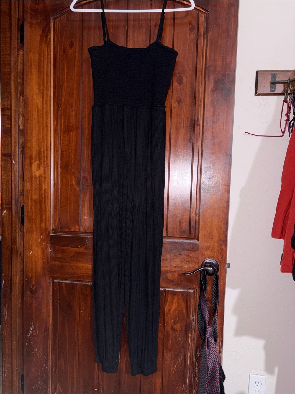 Posh Peanut Black Sleeveless Jumpsuit with Smocked Bodice